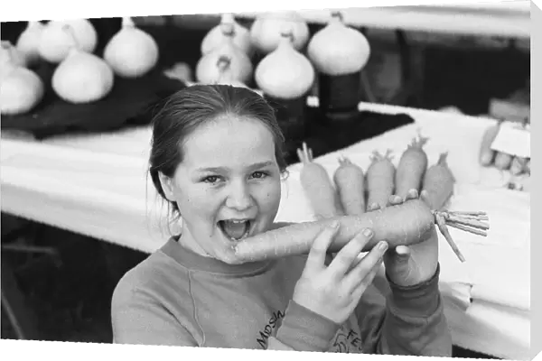 Reading show, in Reading Berkshire. (Picture) Girl holding a carrot at the show