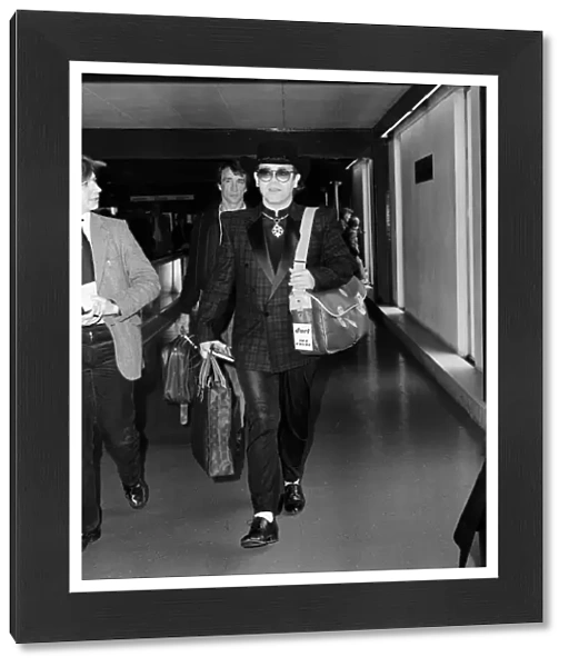 Elton John leaving Heathrow Airport for Los Angeles. 6th April 1981