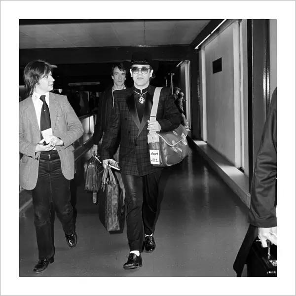 Elton John leaving Heathrow Airport for Los Angeles. 6th April 1981