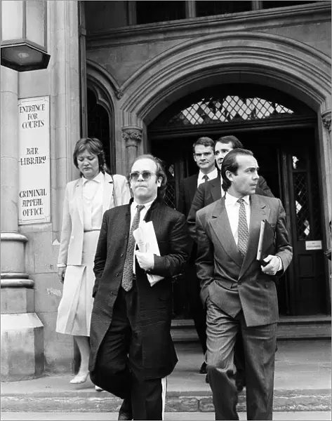 Elton John with Bernie Taupin at the High Court in London