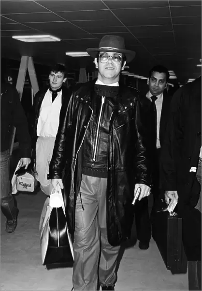 Elton John at Heathrow airport. 7th February 1982