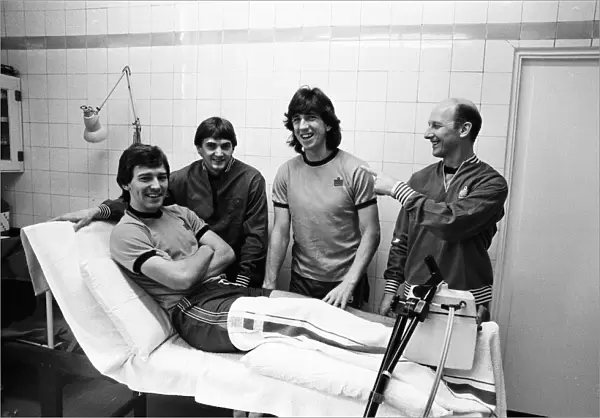 England player sat the treatment table - skipper Bryan Robson gets the attention of Fred