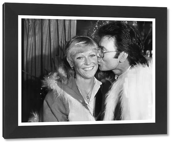Sue Barker and Cliff Richard kissing at Variety Club event - December 1983