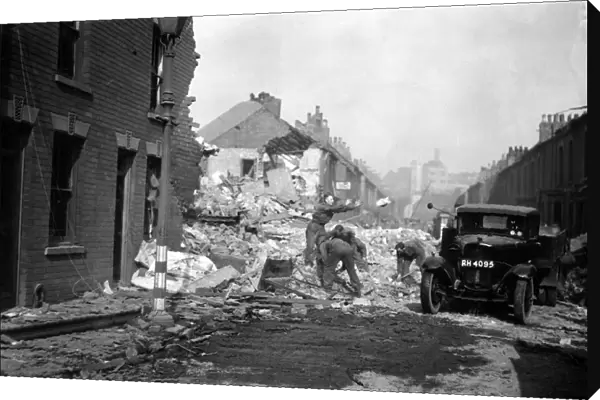 Soldiers assist in clearing up the debris after a raid on Rokeby Avenue, Hull