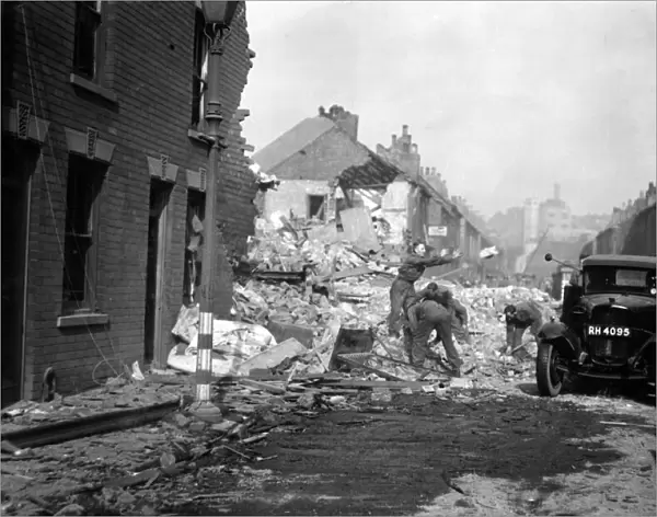 Soldiers assist in clearing up the debris after a raid on Rokeby Avenue, Hull