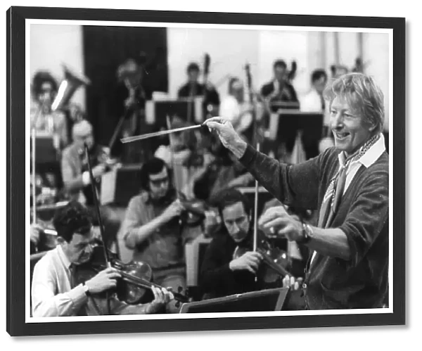 Danny Kaye rehearses conducting the London Symphony Orchestra prior to concert at