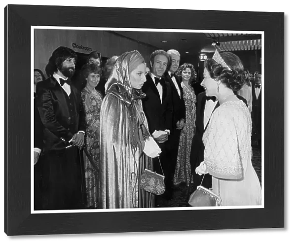 The Queen meeting Barbra Streisand watched by James Caan