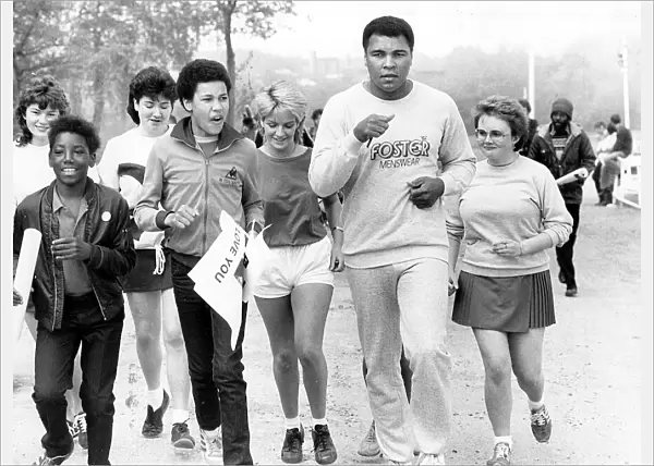 Muhammad Ali goes for a run around Edgbaston Reservoir with students from Edgbaston