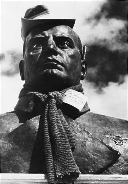 A bust of Mussolini decorated with an Australian hat and scarf. 8th May 1943