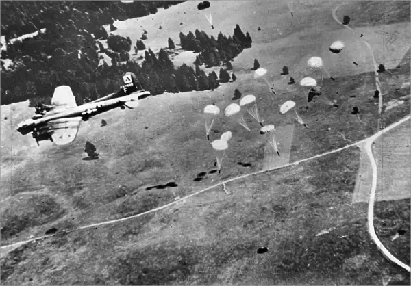 B-17 Flying Fortresses of the U. S. A. A. F. drop supplies to Maquis. August 1944