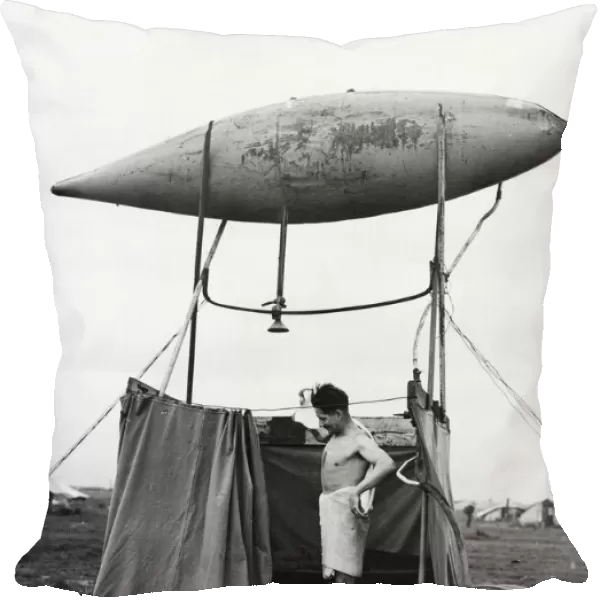 Improvised shower made from an empty fuel tank in Eastern Italy, used by Aircraftman C