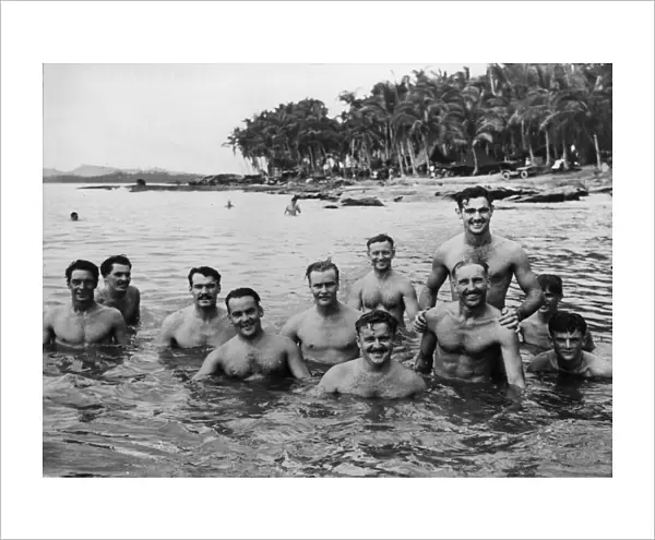 Members of the Royal Australian Air Force enjoy a dip in the cool sea waters as a