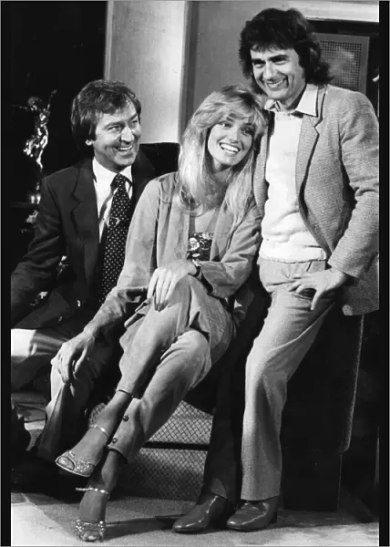 Dudley Moore and Susan Anton laughing during filming interview with Des O