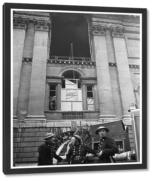 Firemen of the NFS outside The Mansion House in the City of London which was damaged by