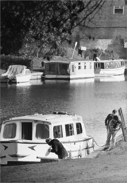 Scenes on the River Cam in Cambridge showing boats being moored. Circa 1975