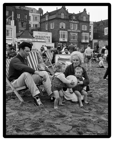 A family enjoying a holiday on the beach at Scarborough, North Yorkshire. May 1964
