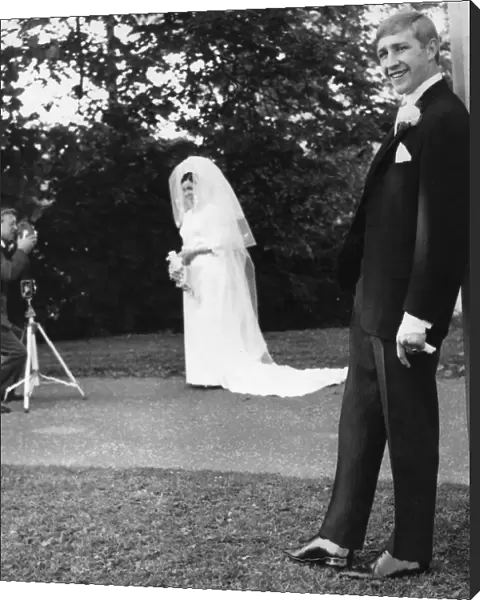 Boxer Ken Buchanan poses for the press during his wedding whilst his wife Carol poses for