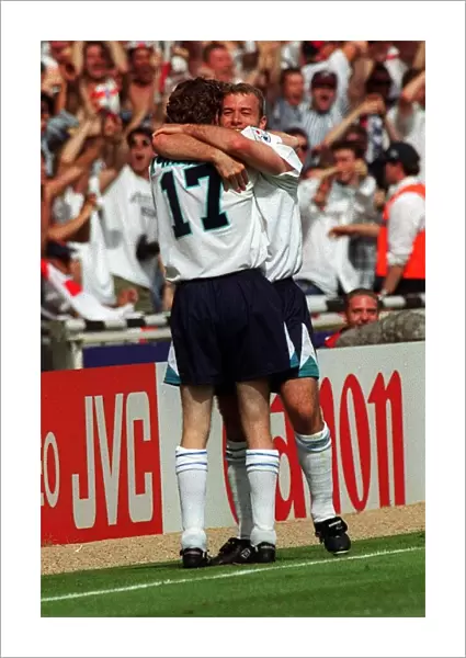 Alan Shearer and Steve McManaman of England celebrate Shearer