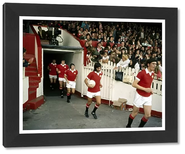 George Best of Manchester United walks onto the pitch at Old Trafford before their