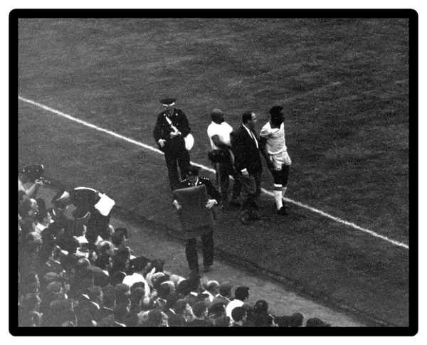Football - World Cup 1966 Portugal v Brazil Pele is led off the pitch injured