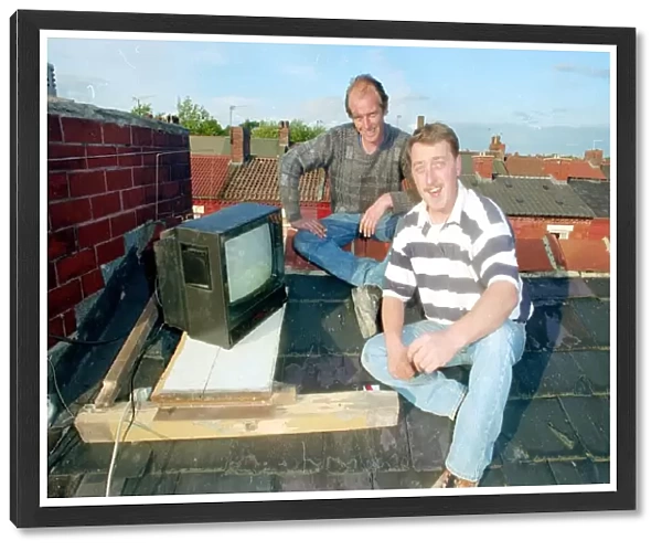 Barry Kirkham and his mate Kevin sitting on a roof top tuning in to the England v West