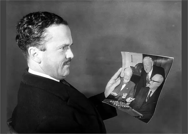 John Cobbold Dec 1959 Ipswich FC Chairman looks at a picture of the FA cup draw which put