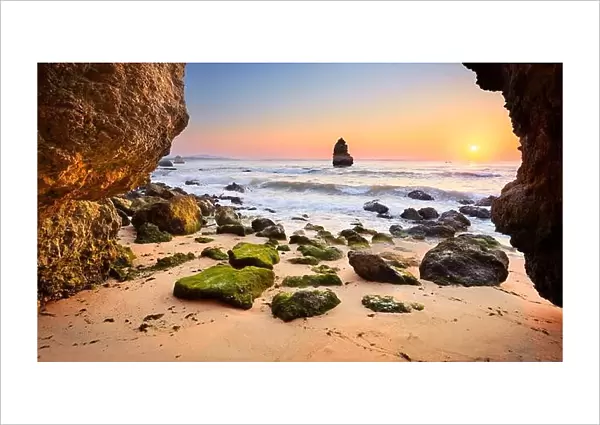 Sunrise at Algarve rocky beach near Lagos, Algarve, Portugal