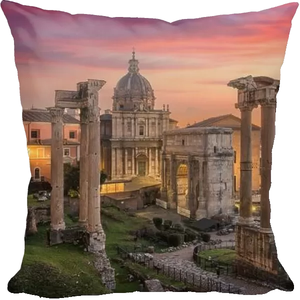 Rome, Italy at the historic Roman Forum ruins at dusk