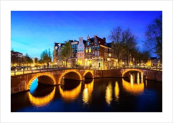 Canals of Amsterdam during twilight in Netherlands. Amsterdam is the capital and most populous city of the Netherlands. Landscape and culture travel