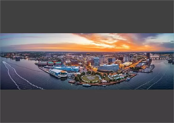 Norfolk, Virginia, USA downtown city skyline from over the Elizabeth River at dusk