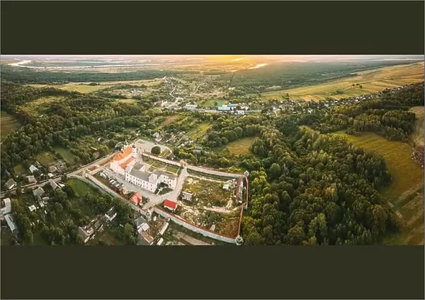 Aerial View Of Jesuit Collegium Complex. Top View Of Holy Nativity-The Theotokos Yurovichi Monastery. Drone View Of Beautiful European Nature From
