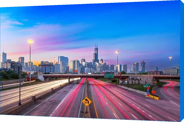 Chicago, Illinois, USA downtown skyline over highways at twilight