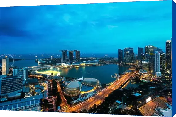Aerial view of Singapore business district and city at night in Singapore, Asia