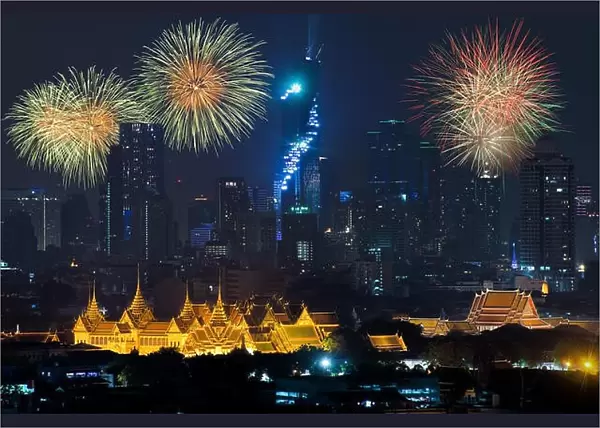 Beautiful fireworks celebrating new year with grand palace and Bangkok city in background at Bangkok, Thailand