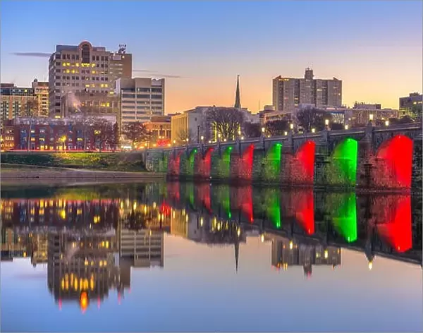 Harrisburg, Pennsylvania, USA skyline on the Susquehanna River with holiday lighting