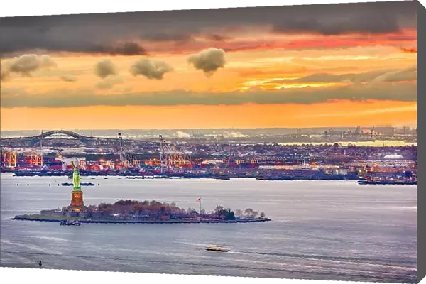 New York Harbor, New York, USA with the Statue of Liberty and Bayonne, New Jersey in the background