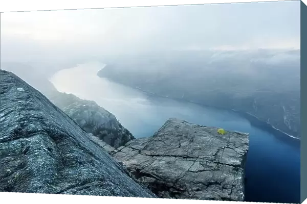 Alone tent near Trolltunga rock - most spectacular and famous scenic cliff in Norway