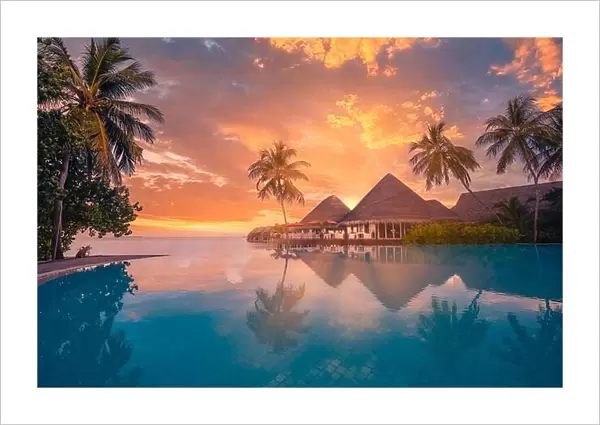 Sunset tourism landscape. Luxurious beach resort with swimming pool reflection beach with palm trees, sunset sky sun rays. Amazing travel background