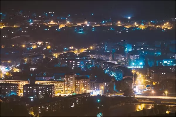 Gori, Shida Kartli Region, Georgia. Cityscape With Night Streets In Bright Yellow Evening Illumination In Twilight. Aerial View Of City