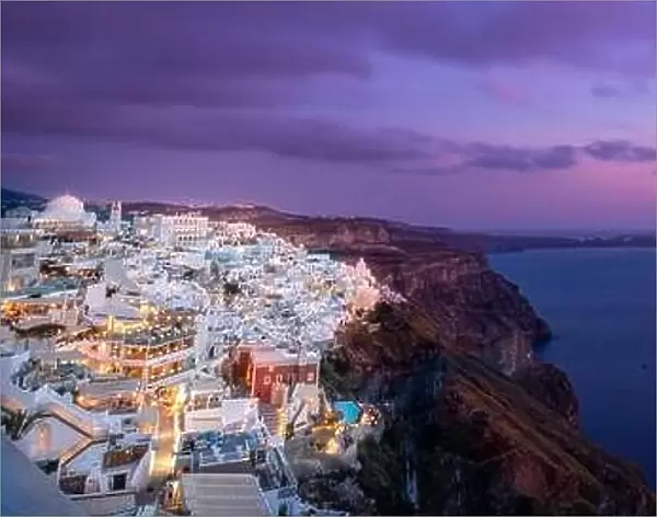 Amazing evening view of Santorini island. Picturesque spring sunset famous Greek resort Fira, Greece, Europe. Traveling concept background. Art summer