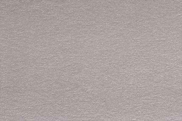 Close up aka macro shot of grey construction paper, showing text