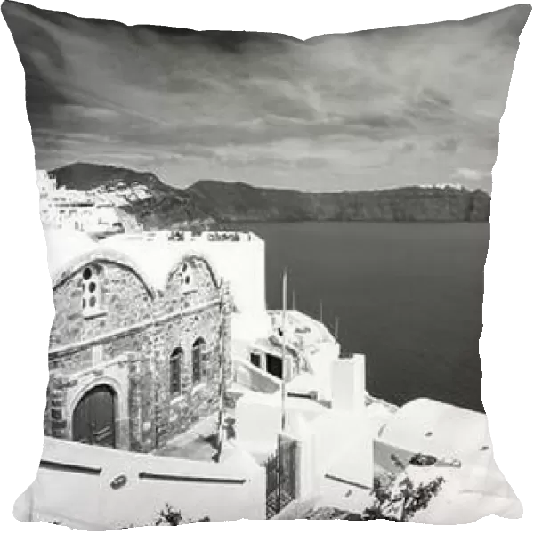 Black and white image of white architecture in Santorini Oia, Greece. Monochrome travel landscape. Dramatic process, Aegean sea in black and white