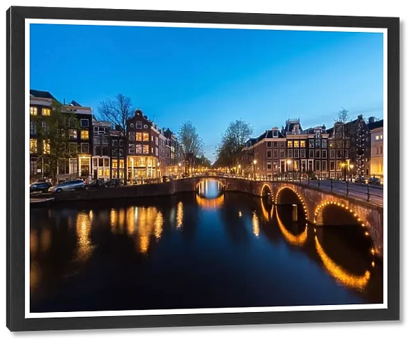 Canals of Amsterdam at night. Amsterdam is the capital and most populous city of the Netherlands