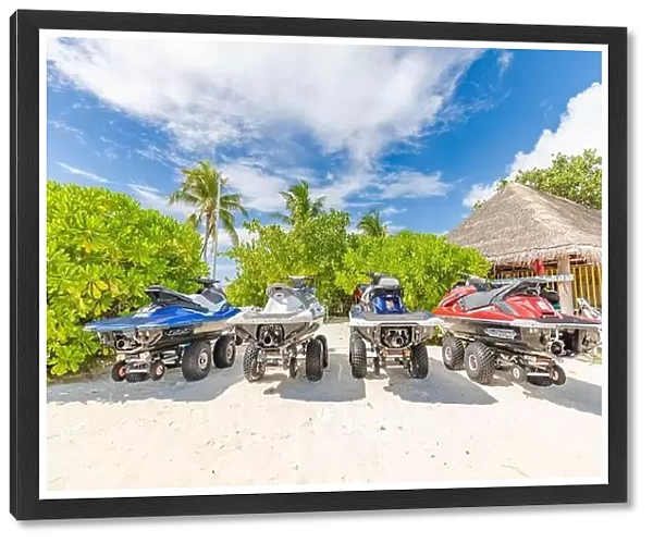 14.12.2019 - Ari atoll, Maldives: Jet skis on tropical beach coast, shore. Resort hotel scenery jet skis parked on the beach for tourist