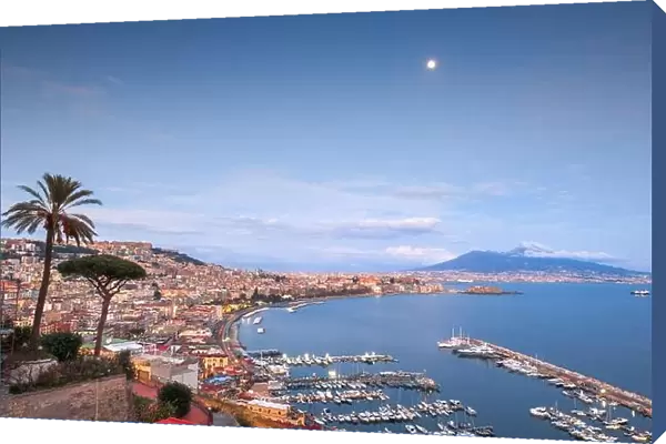 Naples, Italy aerial skyline on the bay with Mt. Vesuvius at dusk