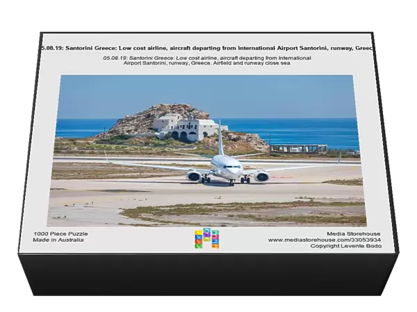 05.08.19: Santorini Greece: Low cost airline, aircraft departing from International Airport Santorini, runway, Greece. Airfield and runway close sea