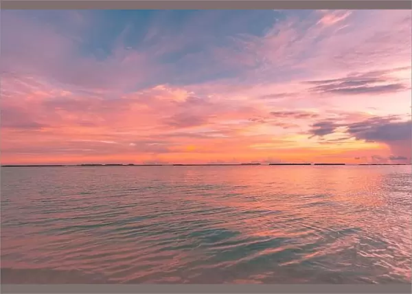 Sunrise over ocean. Majestic colorful sky, peaceful seascape, calm waves surf concept. Sunset sea, endless horizon, orange yellow colors. Tranquil sea