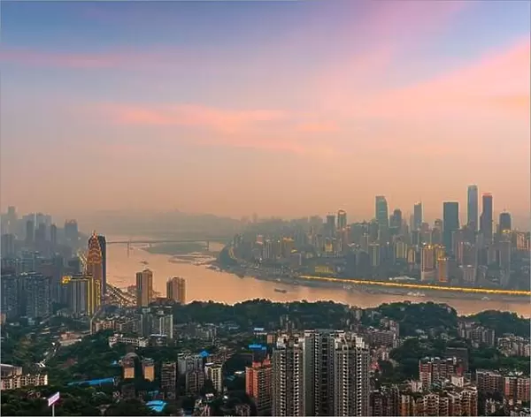 Chongqing, China downtown city skyline over the Yangtze River at sunset