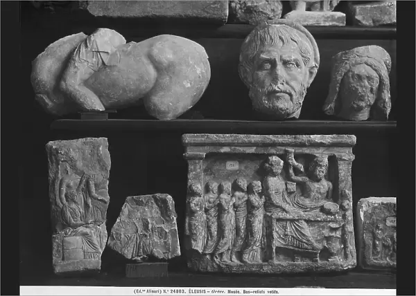 Fragments of statues and votive reliefs dating from the Roman period, in the Archaeological Museum of Eleusis, in Greece