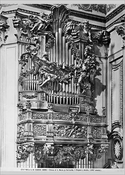 Organ decorated with angels and putti, work preserved in the Church of S. Maria in Vallicella, Rome